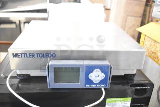 Mettler Toledo BC countertop scale with digital display, stainless steel surface, slight use marks, model BC.
