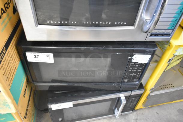 Mainstays P100N30AP-S3B1 microwave oven, black, 120 volts, 1 phase, visible surface wear, auction lot tag attached.