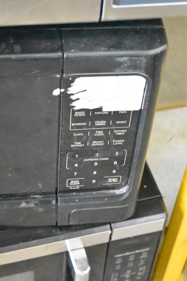 Mainstays P100N30AP-S3B1 countertop microwave, buttons visible, used condition, 120 volts, 1 phase.