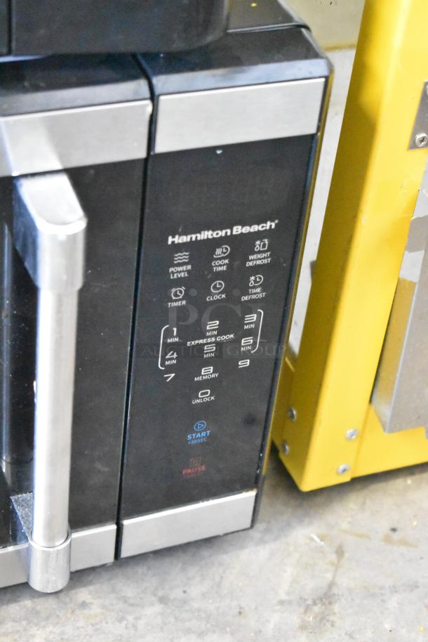 Mainstays countertop microwave oven, model HB84619315-01, 120 volts, 1 phase, black and silver with control panel.