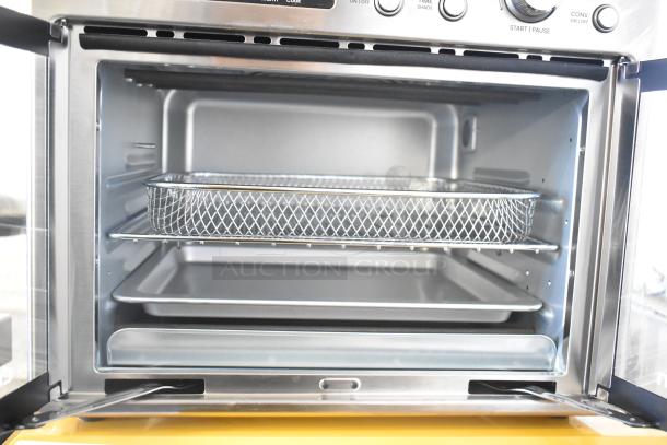 Chefman RJ50-FDAF-D25 Digital French Door Air Fryer Oven, stainless steel, open, visible wire basket and trays, excellent condition.