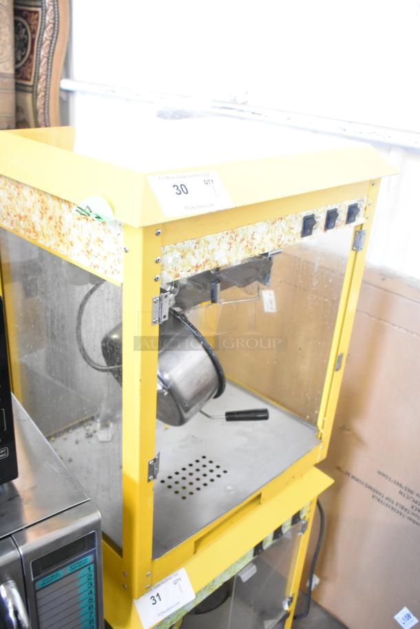 2019 OY-828 metal popcorn machine, yellow, commercial countertop model, 110V, used condition. Visible popcorn design trim.