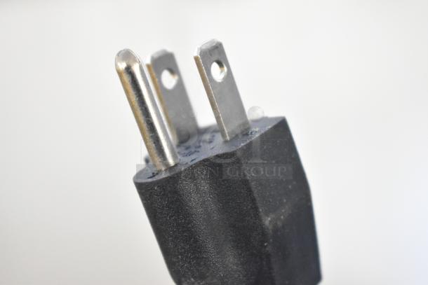 Close-up of a three-prong plug for the 2019 OY-828 Metal Commercial Countertop Popcorn Machine, 110 Volts, 1 Phase.