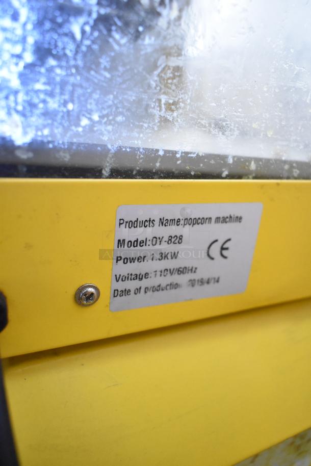 2019 OY-828 commercial popcorn machine label shows model, 1.3KW power, 110V/60Hz, production date 2019/4/14.
