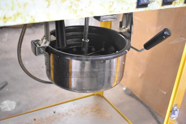 2019 OY-828 Metal Commercial Popcorn Machine, countertop model. Features stainless steel kettle, handle, and power switches. 110V.