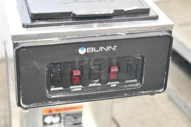 2024 Bunn VP17-2 coffee machine, two-burner, countertop model. Features black and stainless design, dual switches marked "Lower" and "Top." 120 volts, 1 phase.