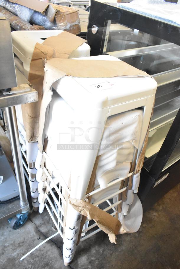 10 new white bar stools, scratch and dent condition, partially wrapped in packaging, stacked in storage.