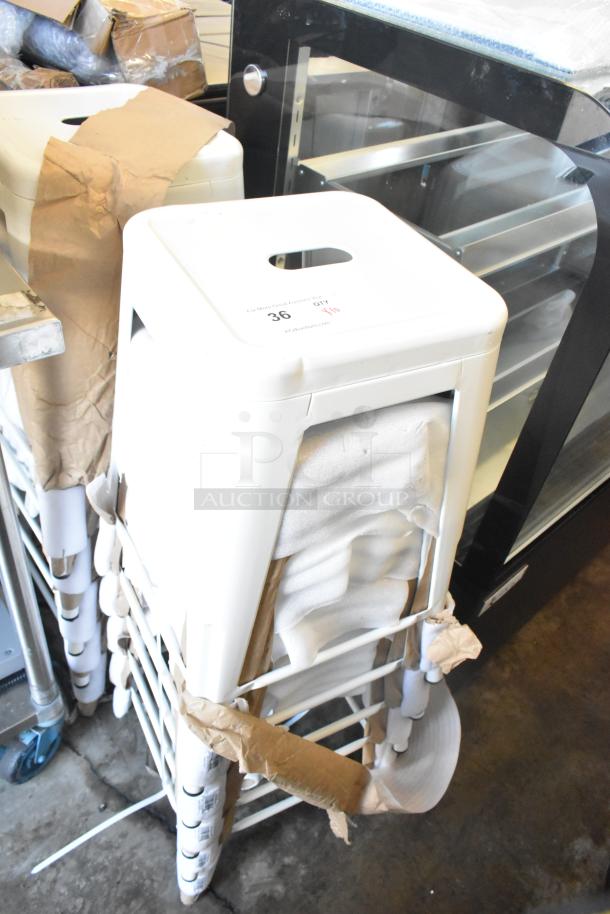 10 new white bar stools, scratch and dent. Wrapped with protective paper. Label shows quantity as 10.