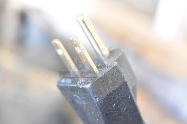 Close-up of a three-prong plug belonging to a 2025 Vollrath FFEB800 electric fryer, 208-240V, 1 phase, scratch and dent condition.