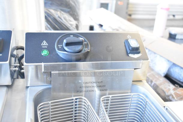 Brand new Vollrath FFEB800 2-bay deep fryer, scratch and dent, 208-240V, 1 phase, with caution labels; controls shown.