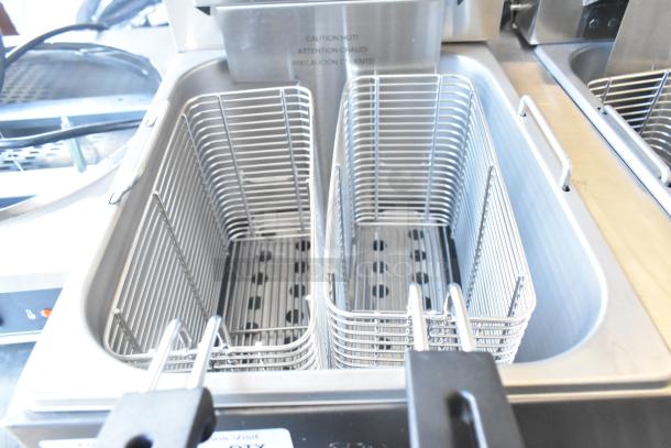 Brand new Vollrath FFEB800 electric fryer, 2-bay, with baskets. 208-240V, 1 phase. Scratch and dent condition.