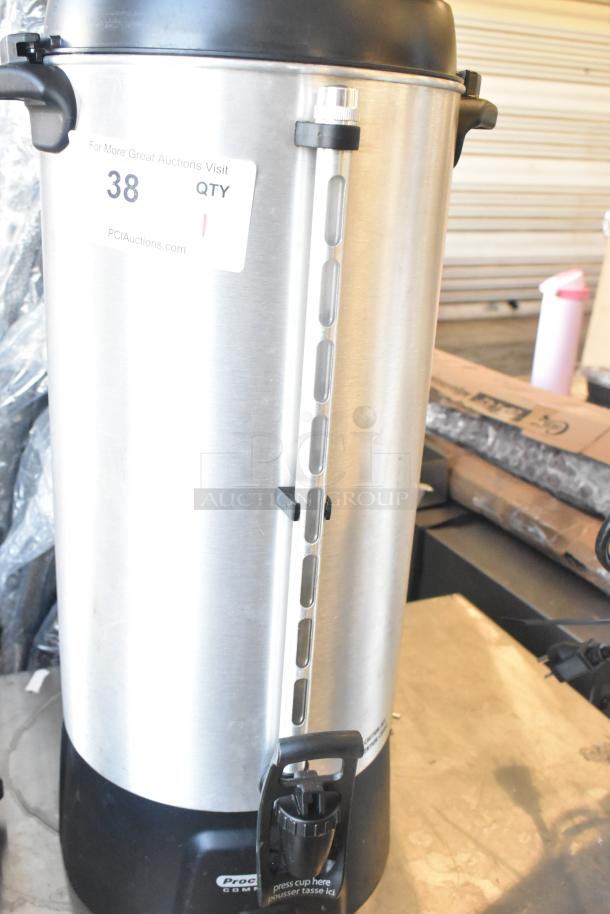 Brand new Proctor Silex countertop beverage dispenser, 115V, 1 phase, stainless steel finish, minor scratches, label visible.