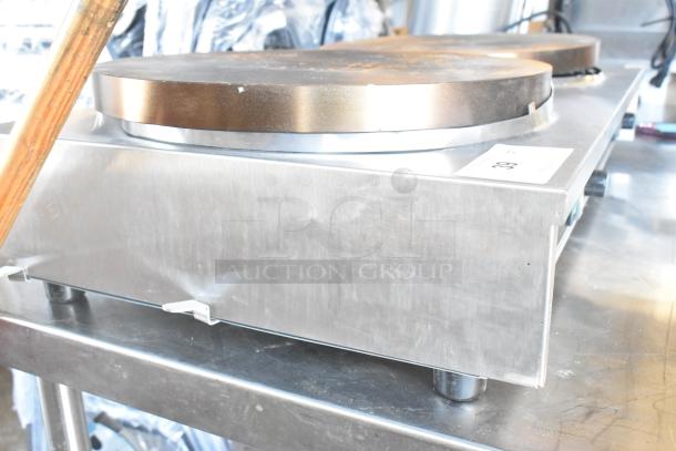 Brand new Krampouz commercial 2 burner crepe maker, countertop model, visible dent on the side, stainless steel finish.