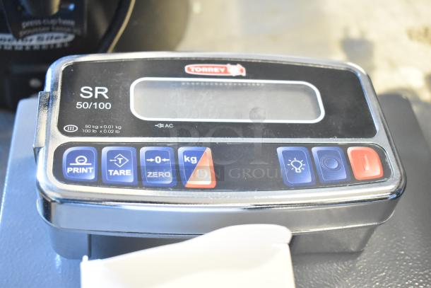 Brand new Avantco Torrey SR-50/100 digital bench scale, 100 lb. capacity. Features include print, tare, zero, kg/lb options. Scratch and dent condition.