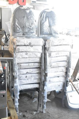 20 new Lancaster banquet chairs, black with 2" padded seat, silver vein frame. Wrapped stacks, barcode labels visible.