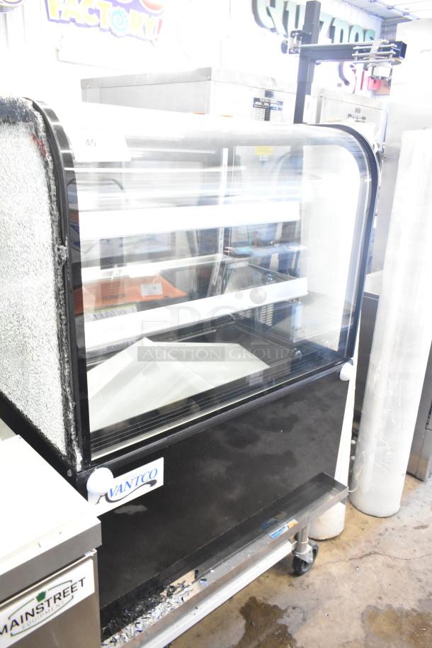 Brand new Avantco 193BCD36B 36" black dry bakery display case with curved glass; visible glass damage shown.