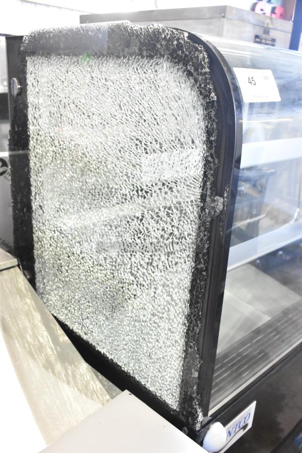 Brand new Avantco 193BCD36B dry bakery display case with curved glass. Note significant glass damage on side panel. 110-120V, 1 Phase.
