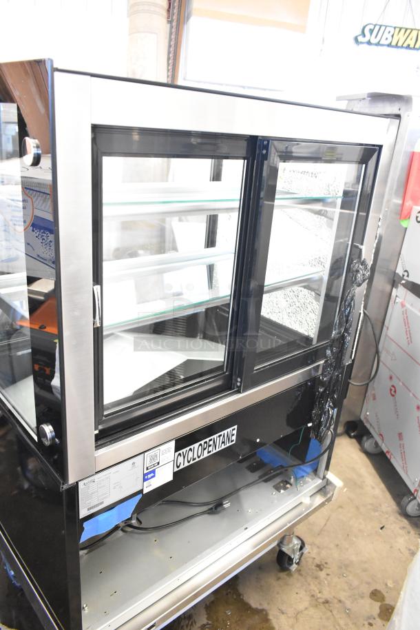 Brand new Avantco 193BCD36B 36" black bakery display case. Notable broken glass on right. Tags: 110-120V, 1 Phase.