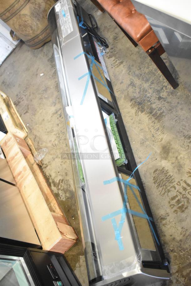 New 2025 Hoshizaki HNC-210BA-L-SLH refrigerated sushi display case, curved glass, 115V, 1 phase, minor scratches.