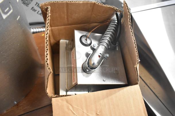 Brand new Wells SS10ULTDCI drop-in food warmer in box, showing control panel. Scratch and dent condition. 120V, 1 phase.