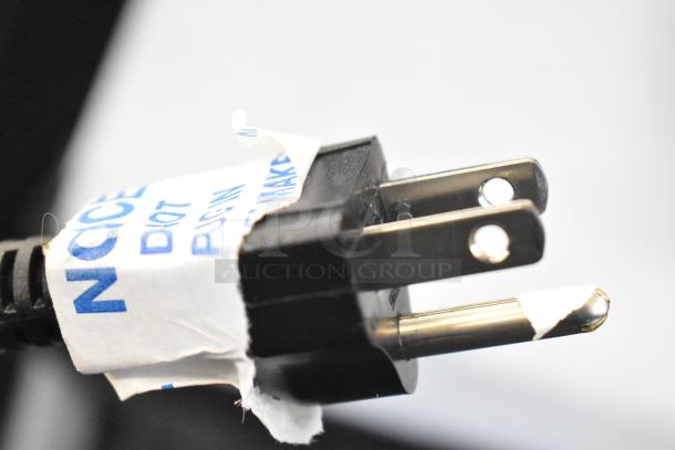 Close-up of a power plug on a Bunn VP17-3 coffee brewer. Label partially visible, indicating power phase details.