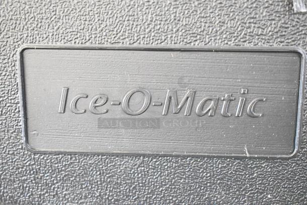 "Brand new Ice-O-Matic ICEU220HA5 ice machine label, textured black surface, features brand name prominently."