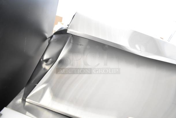 Brand new Avantco 178APT36MHC 2-door mega top prep table. Visible scratch and dent damage on stainless steel surface.