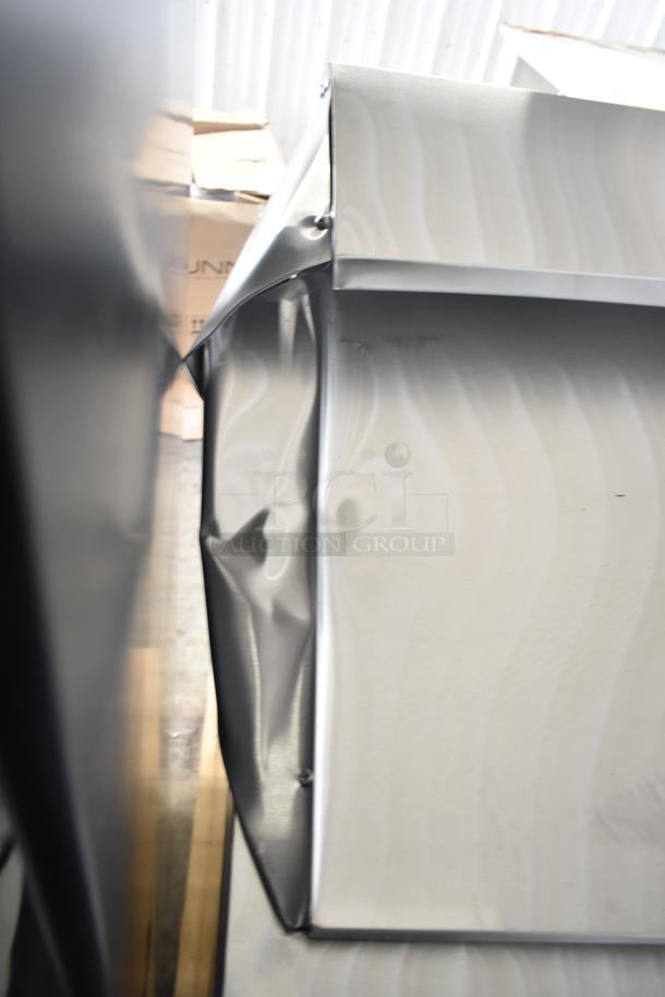 Brand new Avantco 178APT36MHC refrigerated prep table with visible denting on one side, 115 volts, 1 phase.