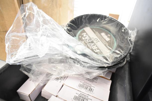 20 new scratch and dent items, including Choice 10" non-stick fry pan and Dominion stainless steel spoons, in packaging.