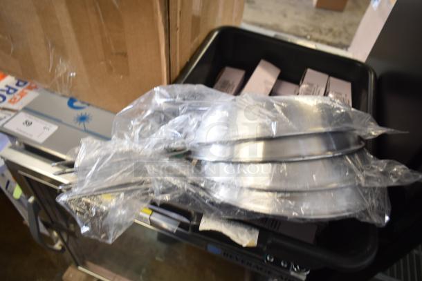 20 brand new scratch and dent items, including Choice 10" aluminum non-stick fry pans, wrapped in plastic.