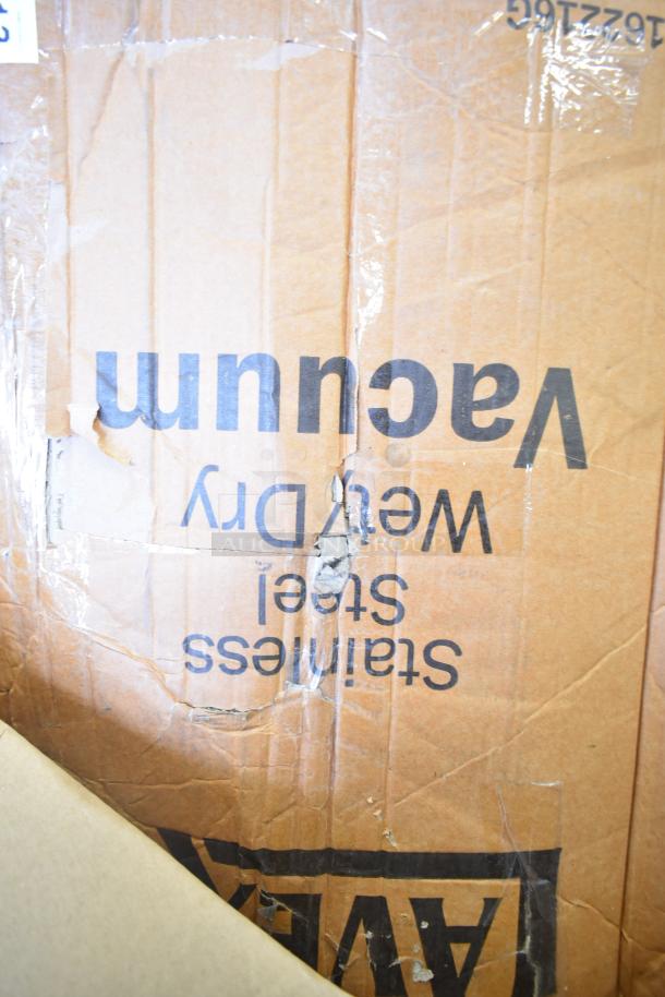Brand new Lavex 16-gallon stainless steel wet/dry vacuum, 944BJ162216G, in original box with visible dents.