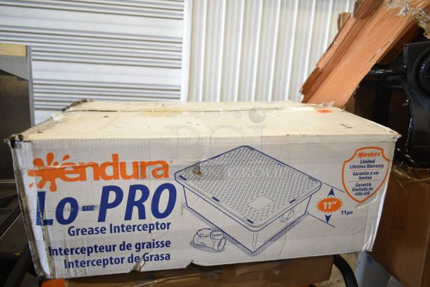BRAND NEW SCRATCH AND DENT! Endura 3925A02LO Lo-Pro grease trap box, showing minor damage. Features 50 lb. capacity, 25 GPM, 2" hub.