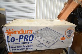 BRAND NEW SCRATCH AND DENT! Endura 3925A02LO Lo-Pro grease trap box, showing minor damage. Features 50 lb. capacity, 25 GPM, 2" hub.