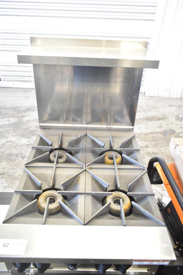 Brand new Vulcan 24S-4BN commercial 4-burner 24" range with standard oven. Scratch and dent condition, 143,000 BTU.