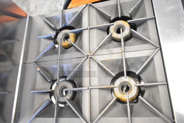 Vulcan 24S-4BN commercial range with 4 burners, natural gas, 24" wide. Brand new, minor cosmetic scratches. 143,000 BTU.