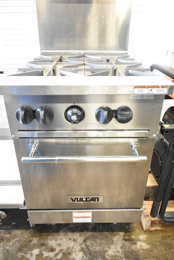 Brand new Vulcan 24S-4BN 24" range with 4 burners and standard oven, 143,000 BTU, stainless steel, slight dents visible.
