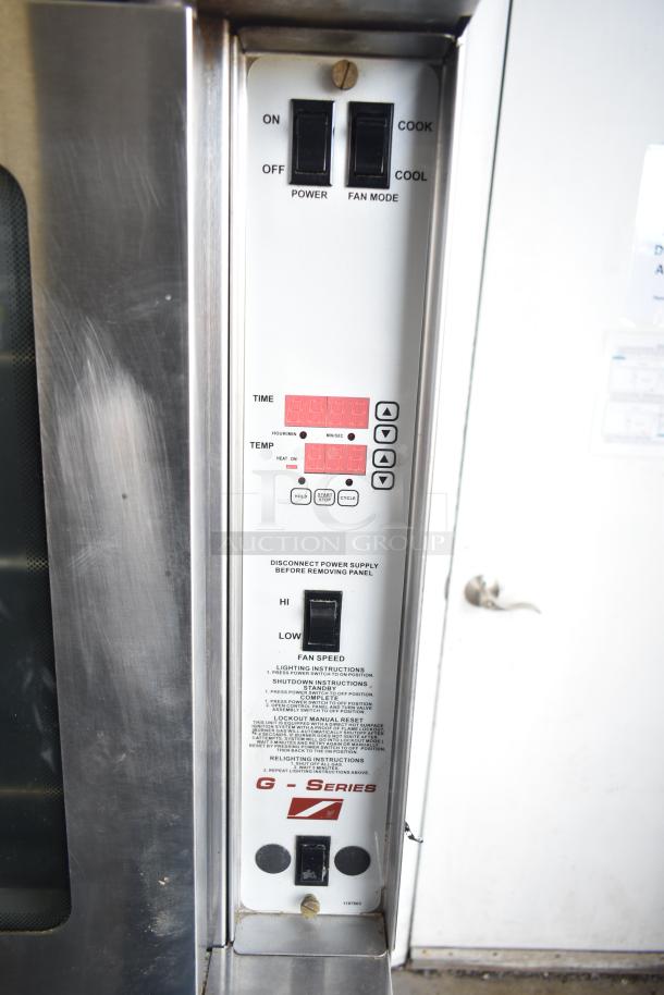 2 Southbend G Series commercial gas convection ovens, view-through doors, thermostatic controls, on commercial casters.