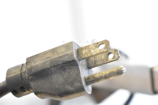 Close-up of a power plug for the Inoksan countertop vertical gyro machine, showing a standard 115V connection.