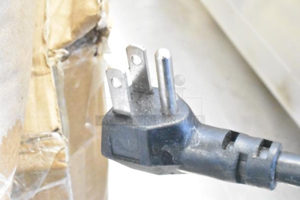 Plug of Atosa MGF8403GR cooler, three-prong design, indicating 115 volts, 1-phase power requirement.