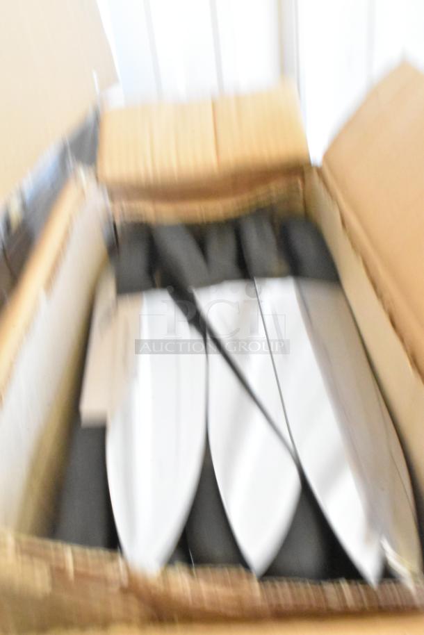 Box of 60 sharpened stainless steel knives, including a chef knife, in packaging. Good condition, suitable for kitchen use.