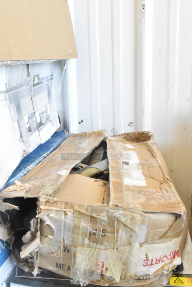 A damaged box containing 60 sharpened stainless steel knives, including a chef knife. Box shows signs of wear.