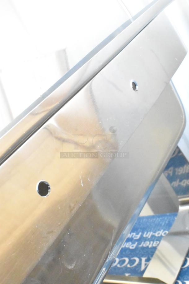 Brand new Choice Deluxe 407COH4 8 Qt. full-size gold accent roll top chafer, scratch and dent condition, stainless steel.