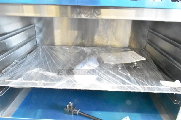 Brand new Avantco 177CHSME32M 32" stainless steel electric cheese melter. Features steel racks, 208/240V. Some scratches.