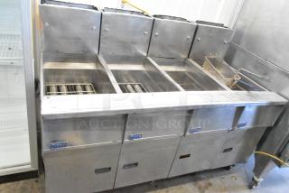 Pitco Frialator stainless steel 4-bay commercial natural gas fryer on casters, 122,000 BTU.