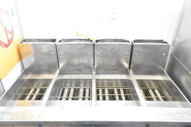 Pitco Frialator stainless steel 4-bay deep fat fryer, natural gas, 122,000 BTU, on commercial casters.