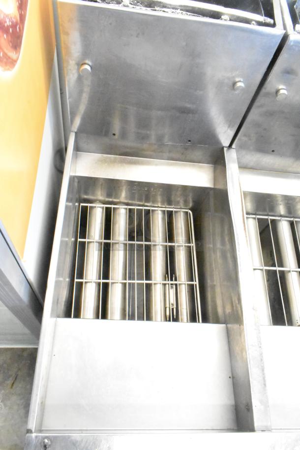 Pitco Frialator stainless steel 4-bay deep fryer, natural gas, on casters. 122,000 BTU. Clean and in good condition.