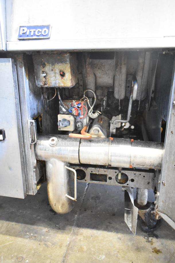 Pitco Frialator stainless steel 4-bay deep fat fryer, natural gas, 122,000 BTU, on commercial casters, interior view.