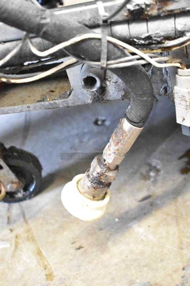 Pitco Frialator stainless steel 4-bay deep fat fryer, natural gas, 122,000 BTU, on casters, minor wear visible.