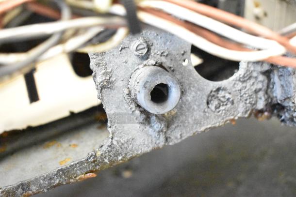 Stainless steel Pitco Frialator 4-bay deep fat fryer, natural gas, 122,000 BTU, on commercial casters; well-used condition.