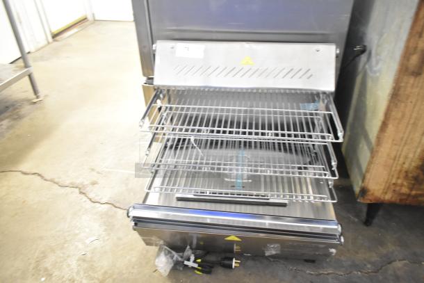 Brand new ServIt 423HDM26SA 26" heated display case, three shelves. Note: broken glass visible. 120V, 1 phase.